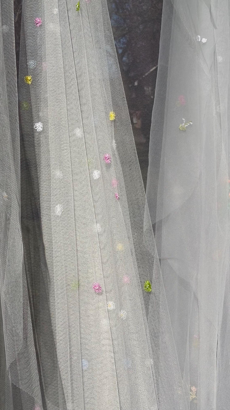 Olivia silk tulle bridal veil by Vowen, scattered with hand-embroidered multicoloured daisies
