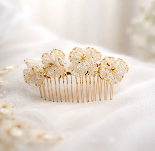 Beatrice bridal hair comb by Vowen, four hand-beaded ivory flowers with gold detailing on ivory silk