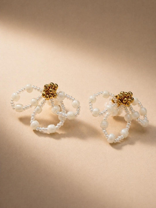 Iris bridal earrings by Vowen, looped ivory beadwork with a gold-tone flower centre