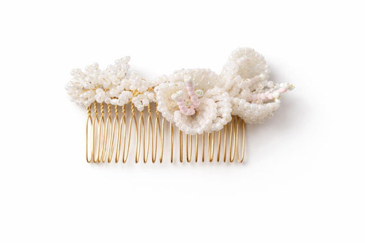 Mabel bridal hair comb by Vowen, three hand-beaded glass flowers with blush centres on a gold-plated comb