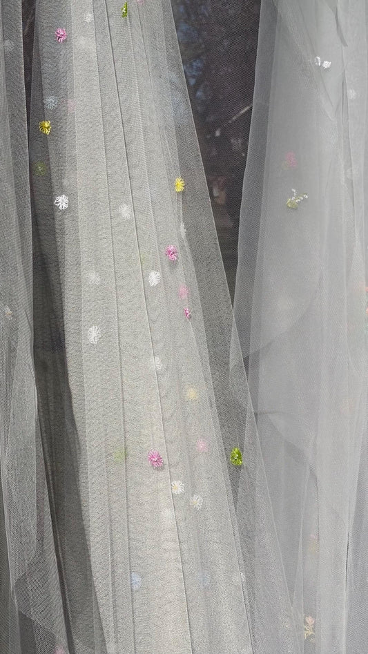 Olivia silk tulle bridal veil by Vowen, scattered with hand-embroidered multicoloured daisies